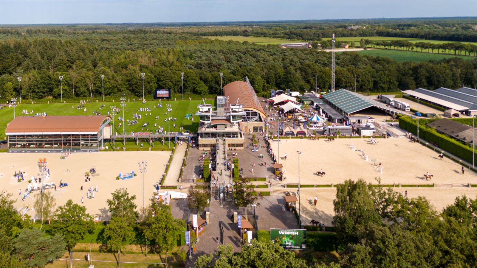 Equestrian riders compete at the Baran Global Hunter Classic, showcasing teamwork, skill, and the elegance of hunter sport at the Longines Tops International Arena.