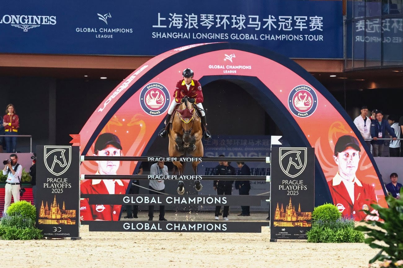 Ben Maher and Max Kühner celebrating victory for Shanghai Swans at the 2025 GCL of Shanghai under the lights of the Shanghai Juss International Equestrian Centre.