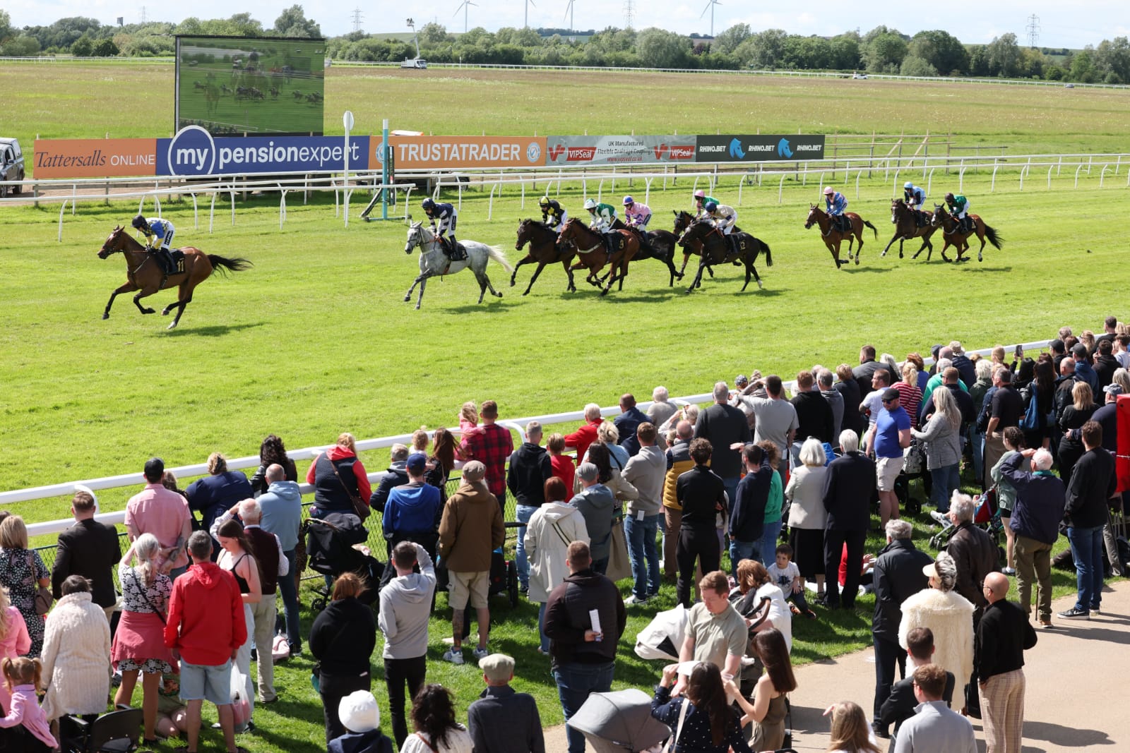 Exciting jump racing underway at Huntington Racecourse with spectators enjoying the afternoon races