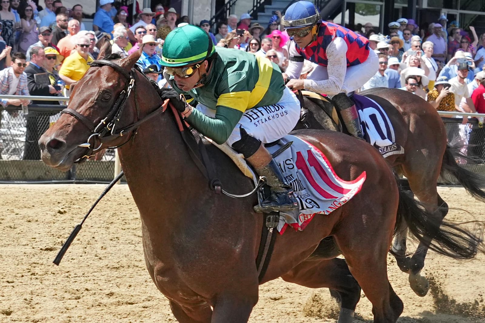 Retribution galloping to victory under Irad Ortiz Jr. in the 2025 Chick Lang Stakes at Pimlico Race Course