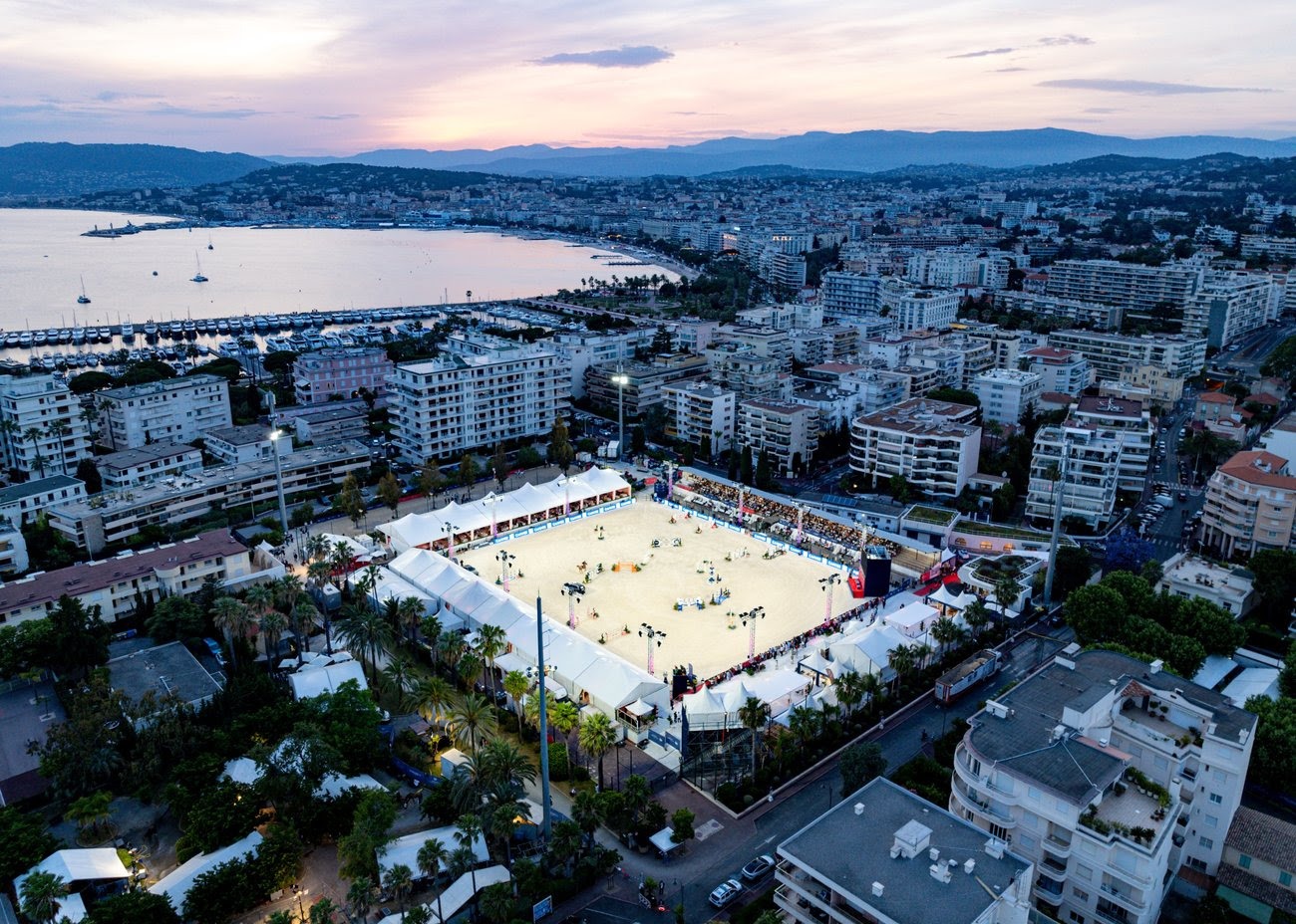 Top show jumpers compete under the lights at the Longines Global Champions Tour in Cannes, set against the French Riviera’s iconic waterfront.