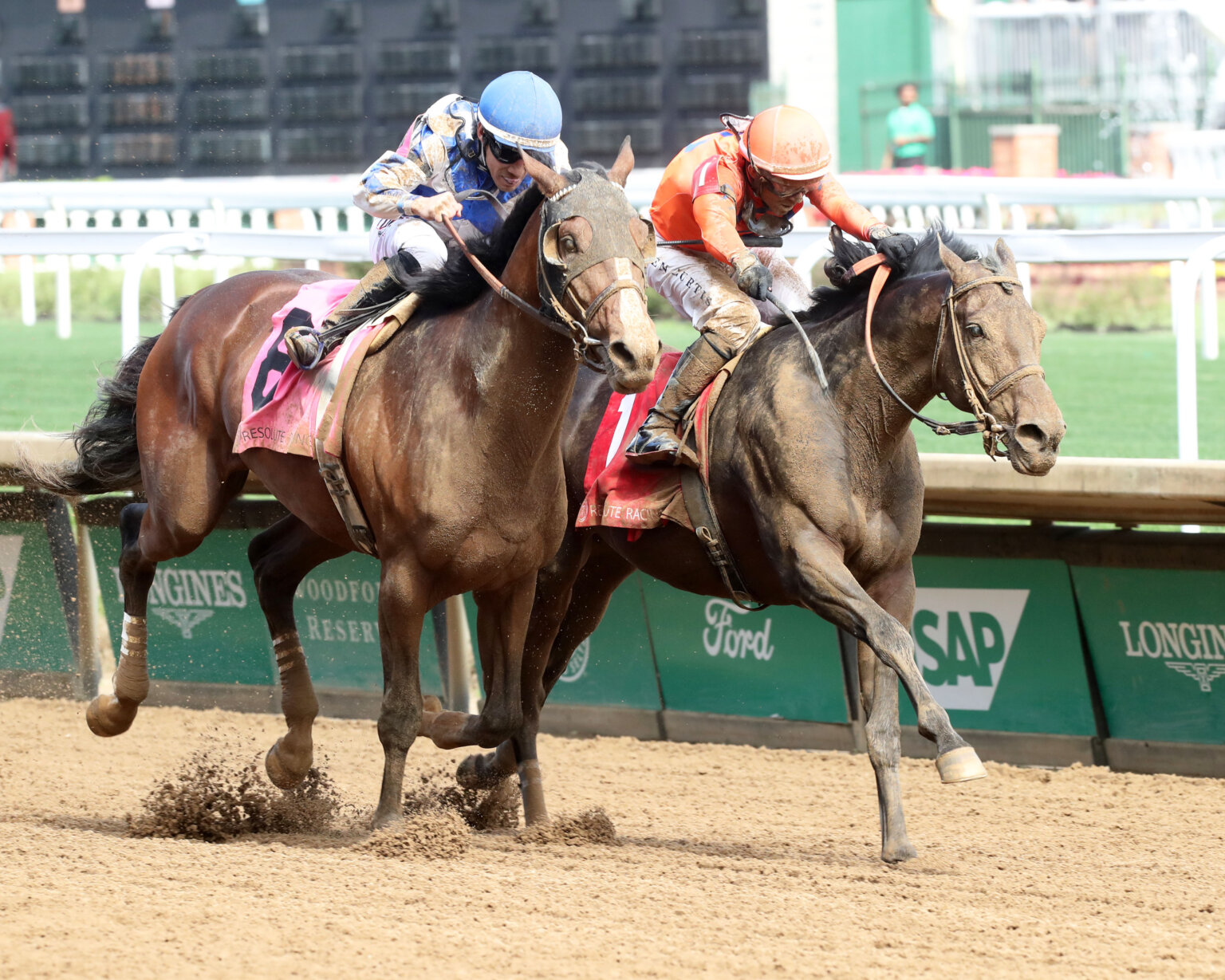 Bridle a Butterfly crosses the finish line ahead of Out On Bail in a thrilling turf sprint at Churchill Downs during the William Walker Stakes.
