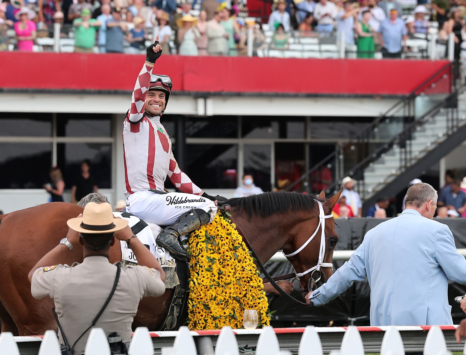 Journalism crosses the finish line ahead of Gosger to win the 150th Preakness Stakes at Pimlico Race Course, with jockey Umberto Rispoli celebrating the victory.