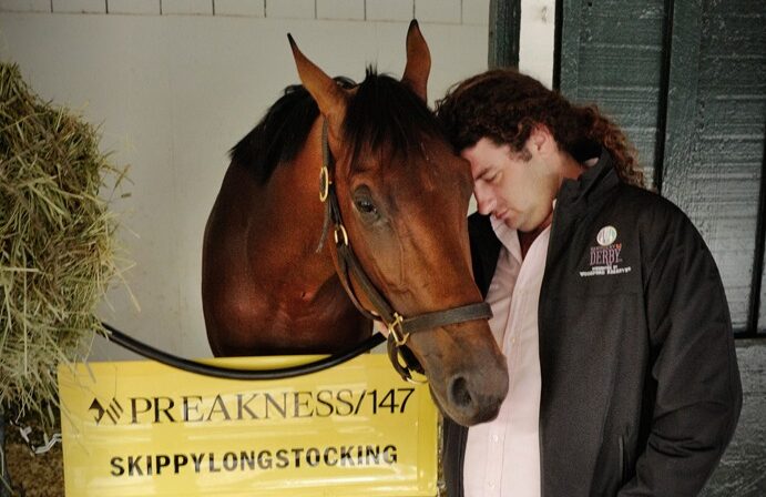 Trainer Saffie Joseph Jr. watches over his horses during morning training at Gulfstream Park