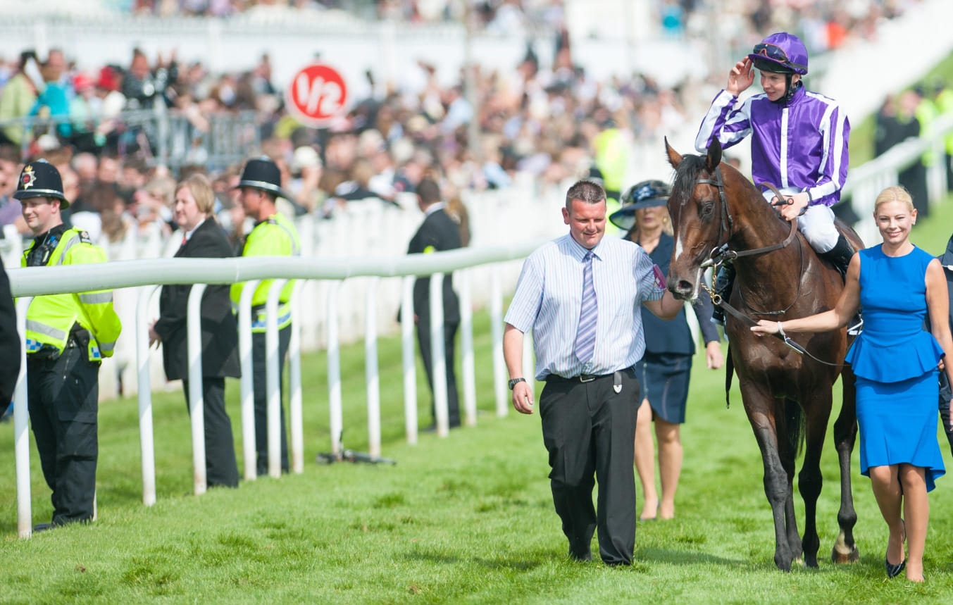 William Buick aboard Ruling Court at Newmarket, celebrating victory in the Betfred 2000 Guineas ahead of their Epsom Derby challenge.