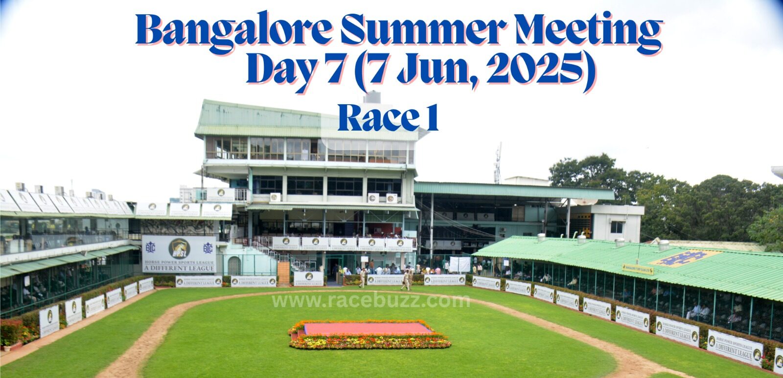 View of the paddock area at Bangalore Turf Club during the Bangalore Summer Meeting, Day 7 (7 June 2025), Race 1. The image shows the green walking ring, flower bed in the center, and surrounding grandstands with Horse Power Sports League branding.