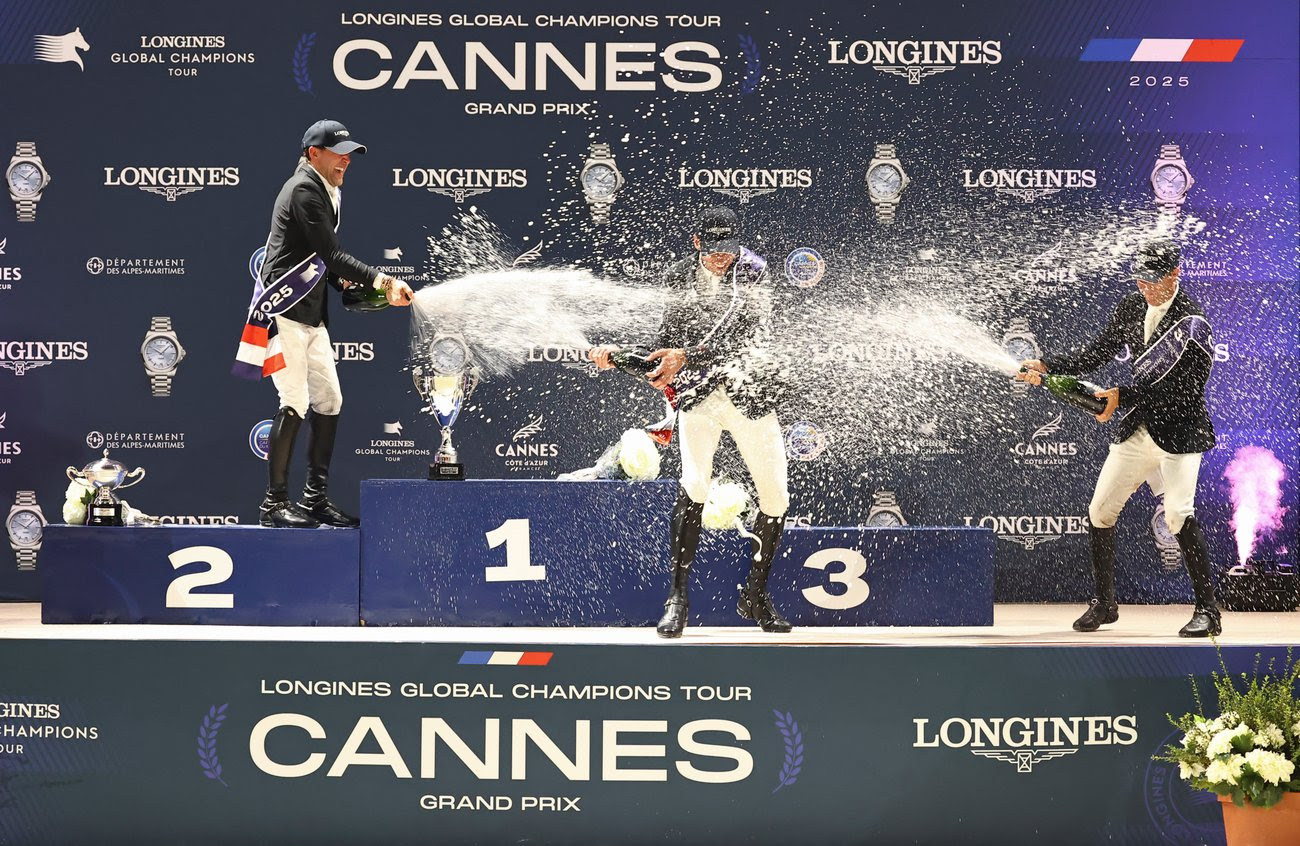 Harrie Smolders and Monaco soaring over a jump under the lights at the Longines Global Champions Tour Grand Prix of Cannes 2025.