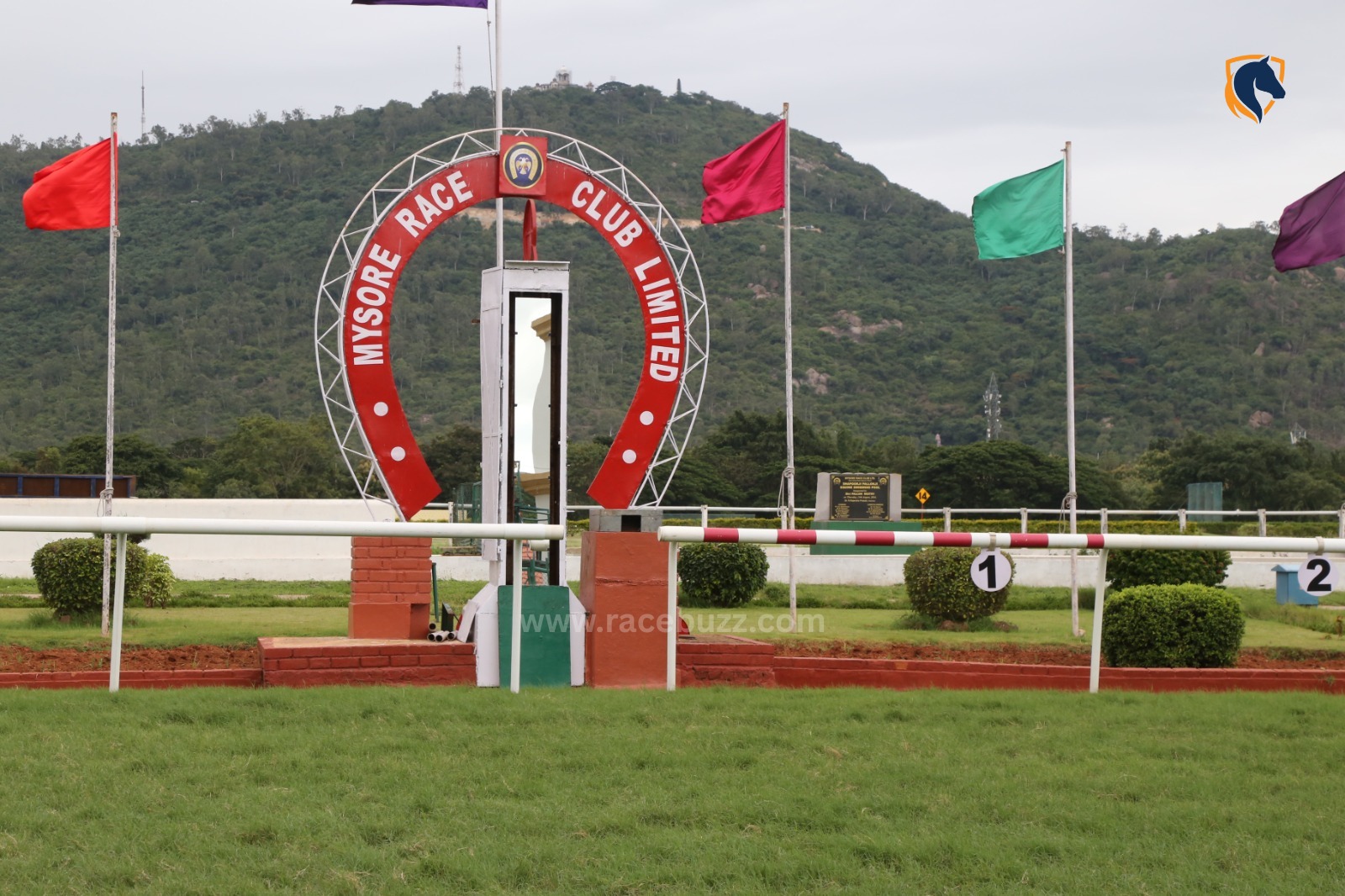 Scenic view of Mysore Race Club during the summer races with jockeys competing on track