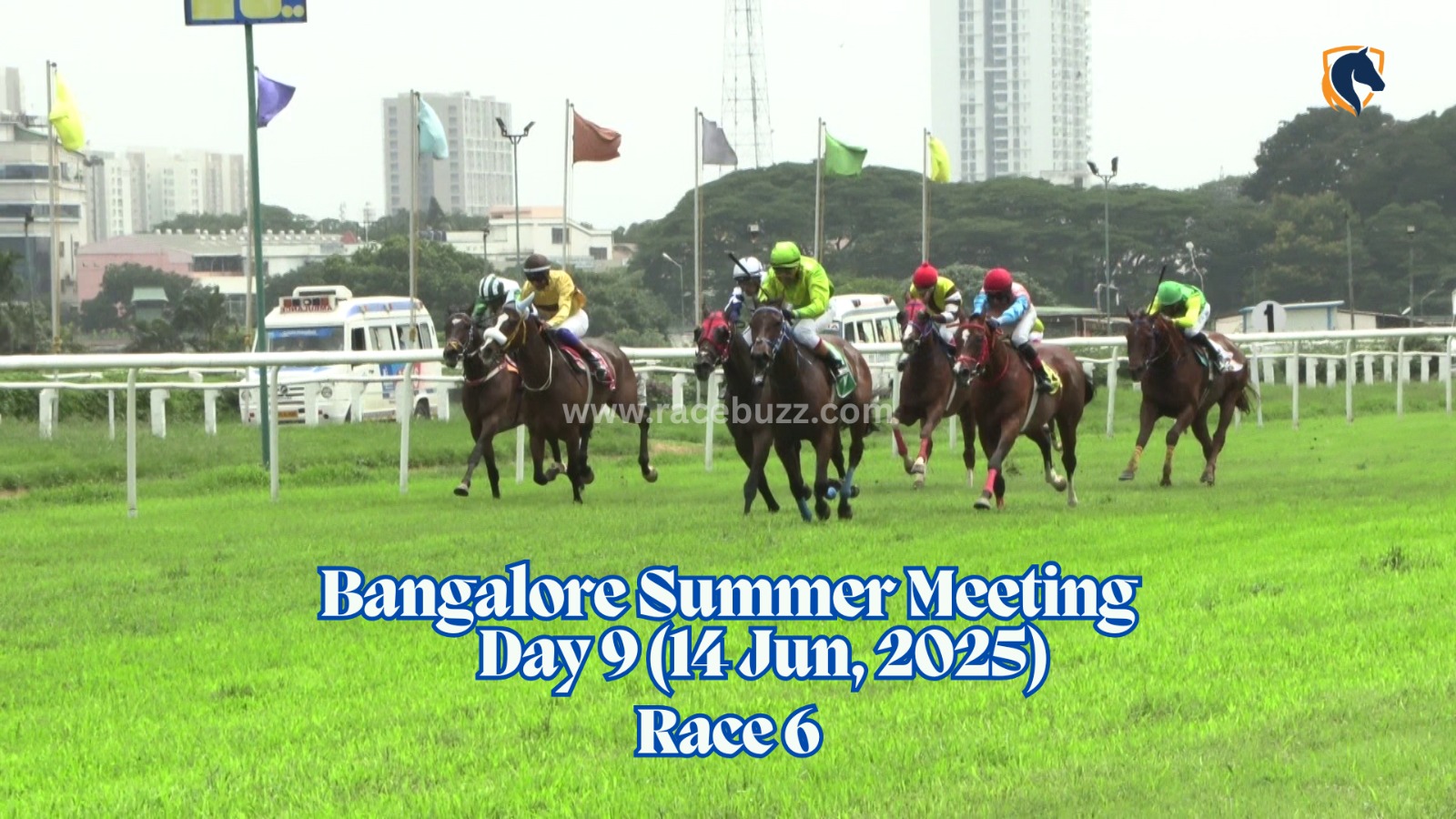 The winning post at Bangalore Turf Club during the Bangalore Summer Meeting 2025, Day 9 (June 14), Race 6, with the BTC arch and race replay screen in the background.
