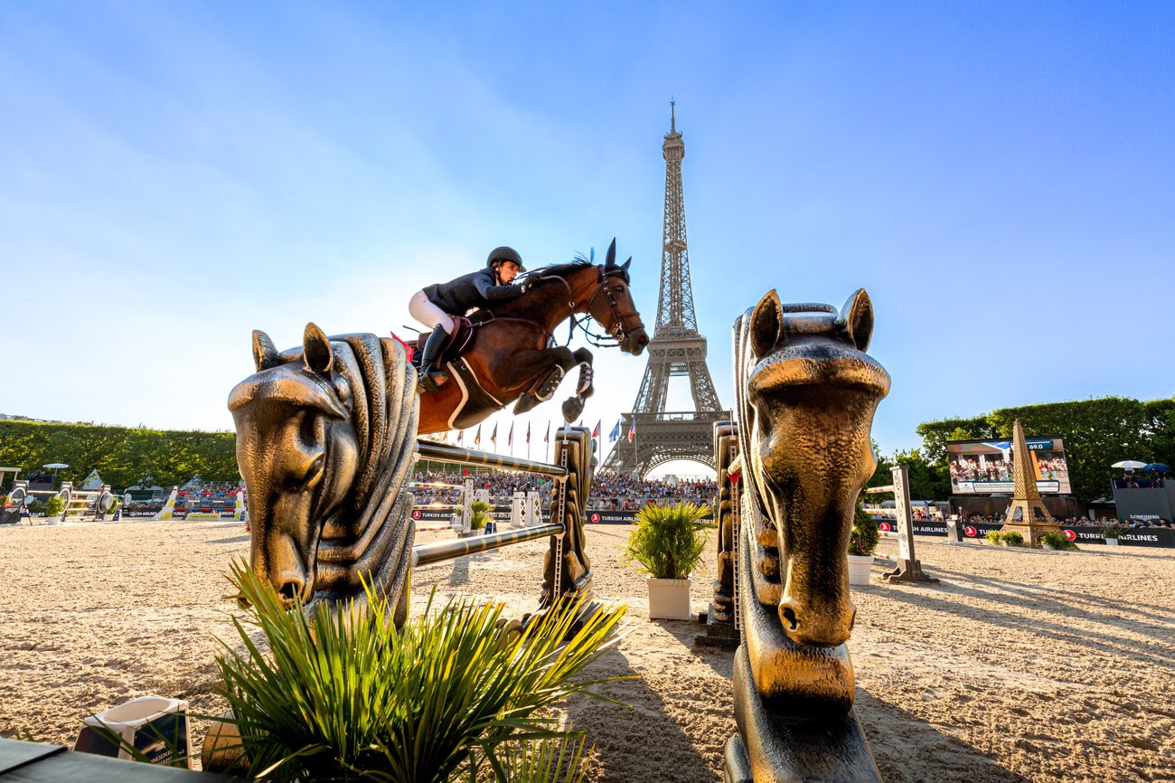 Show jumpers competing under the Eiffel Tower at the Longines Global Champions Tour Paris 2025