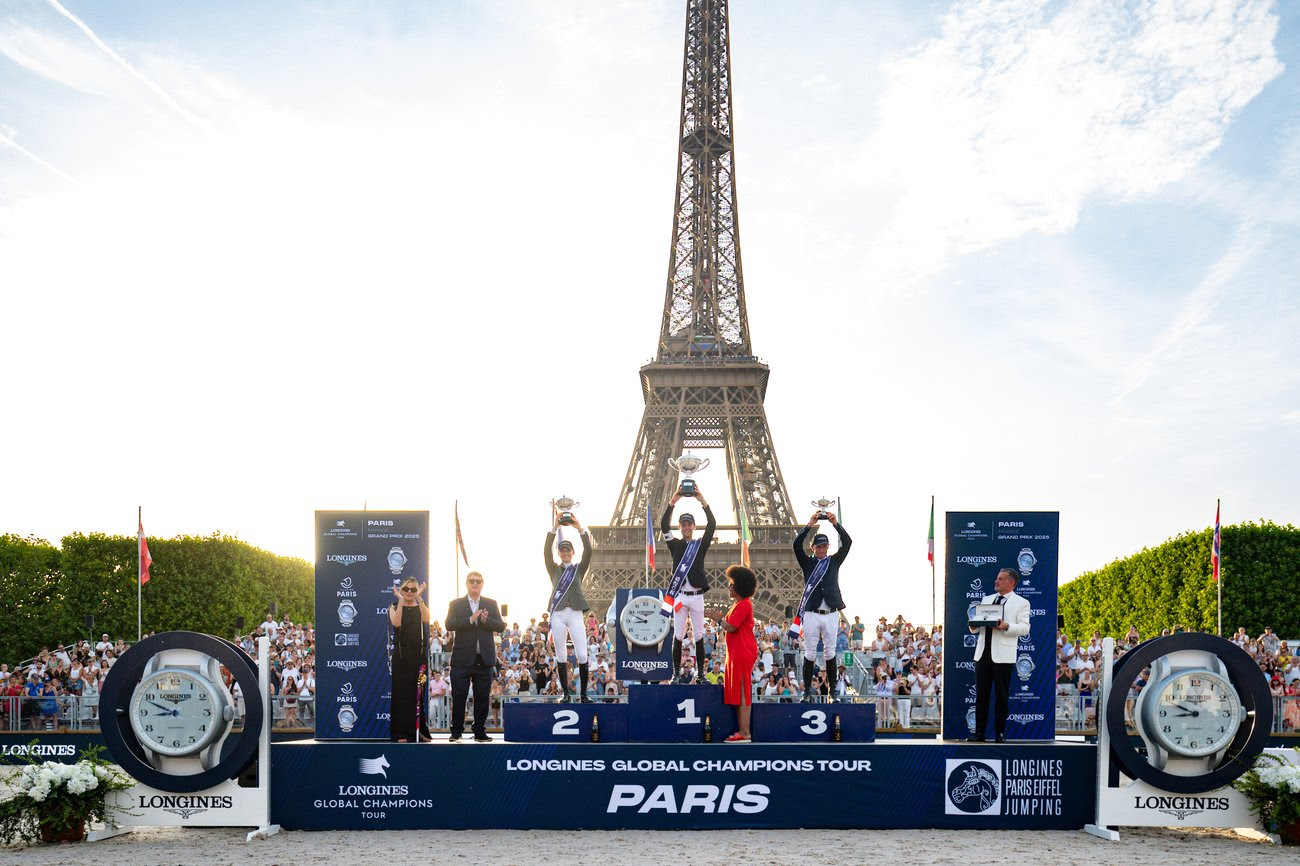 Gilles Thomas and Ermitage Kalone celebrate victory at the Longines Global Champions Tour Grand Prix of Paris 2025 with the Eiffel Tower in the background.