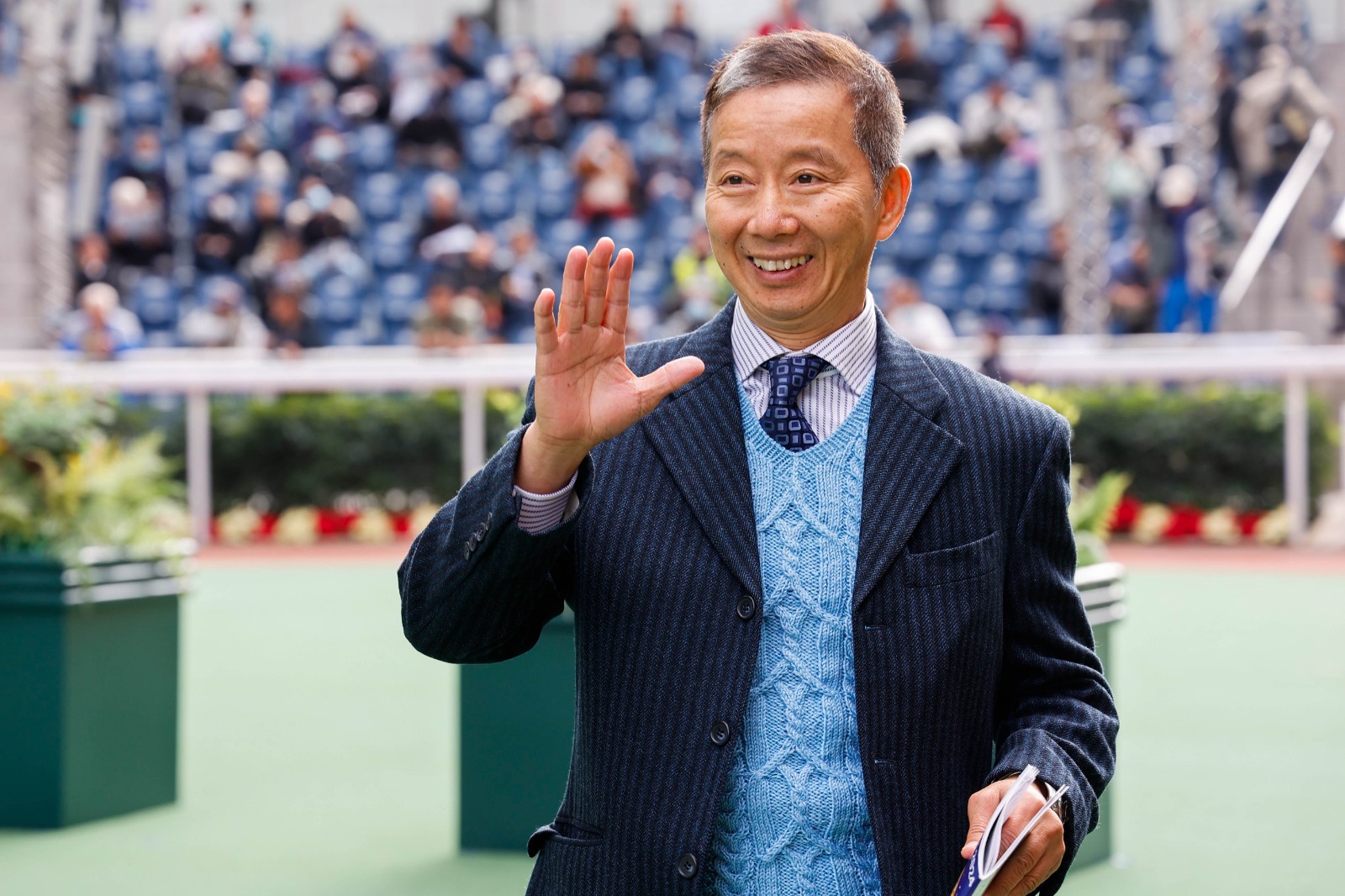 Benno Yung celebrates a racing win at Sha Tin, reflecting on his successful career in Hong Kong racing.