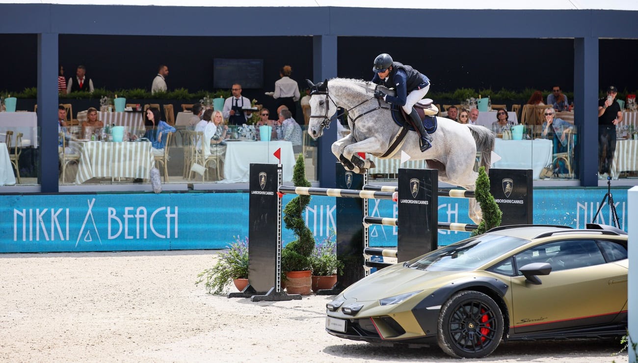 Guests enjoying luxury hospitality at Nikki Beach during the Longines Global Champions Tour event on the French Riviera