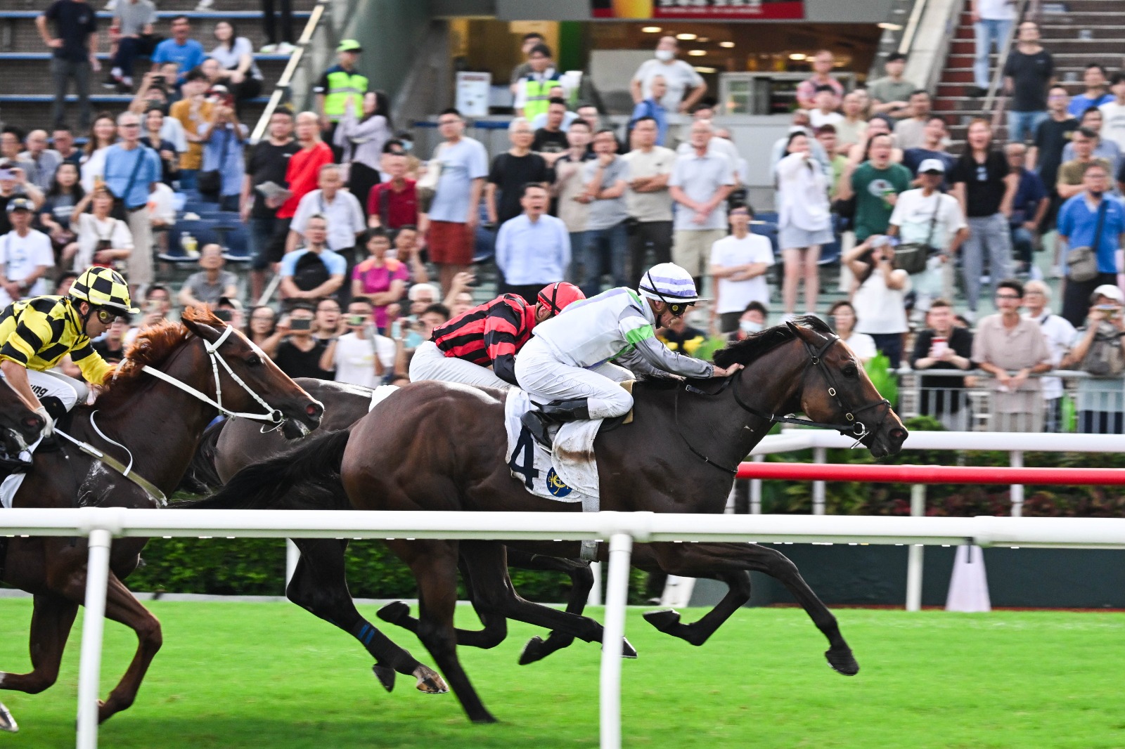 Zac Purton celebrates aboard Light Years Charm after winning the Hong Kong Reunification Cup at Sha Tin Racecourse.