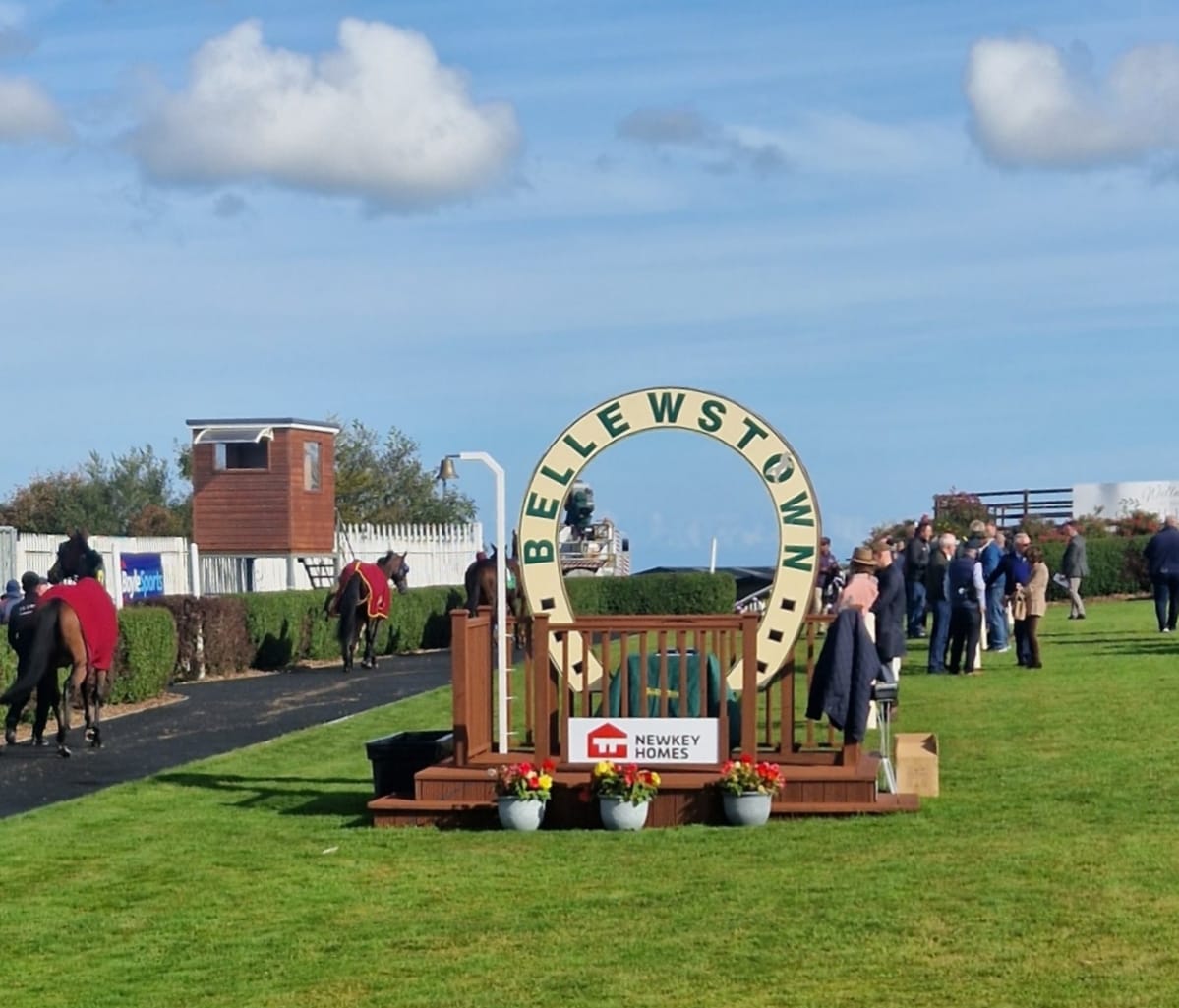 Horses racing at Bellewstown Racecourse during the July Festival 2025 under sunny skies