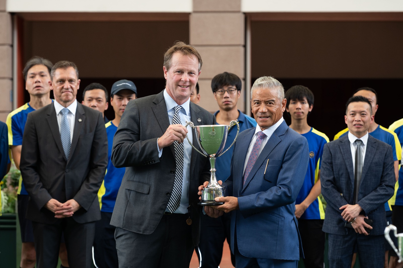 Tony Cruz and stable staff receiving the Safest and Best Housekeeping Stable Award at Sha Tin Racecourse