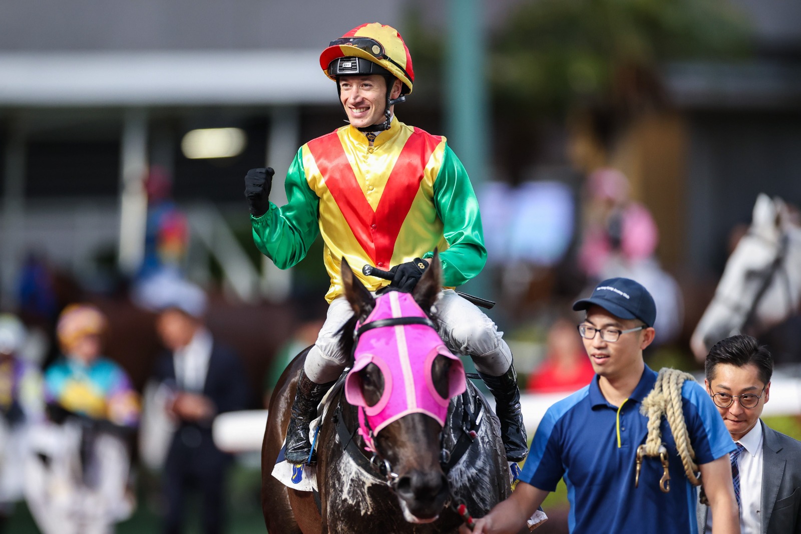 Antoine Hamelin smiles after a race win at Sha Tin Racecourse, celebrating his successful tenure in Hong Kong before returning to France.
