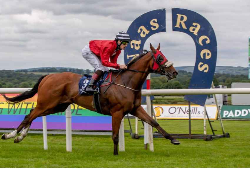 Horses racing at Naas Racecourse during the thrilling July Summer Racing event in County Kildare