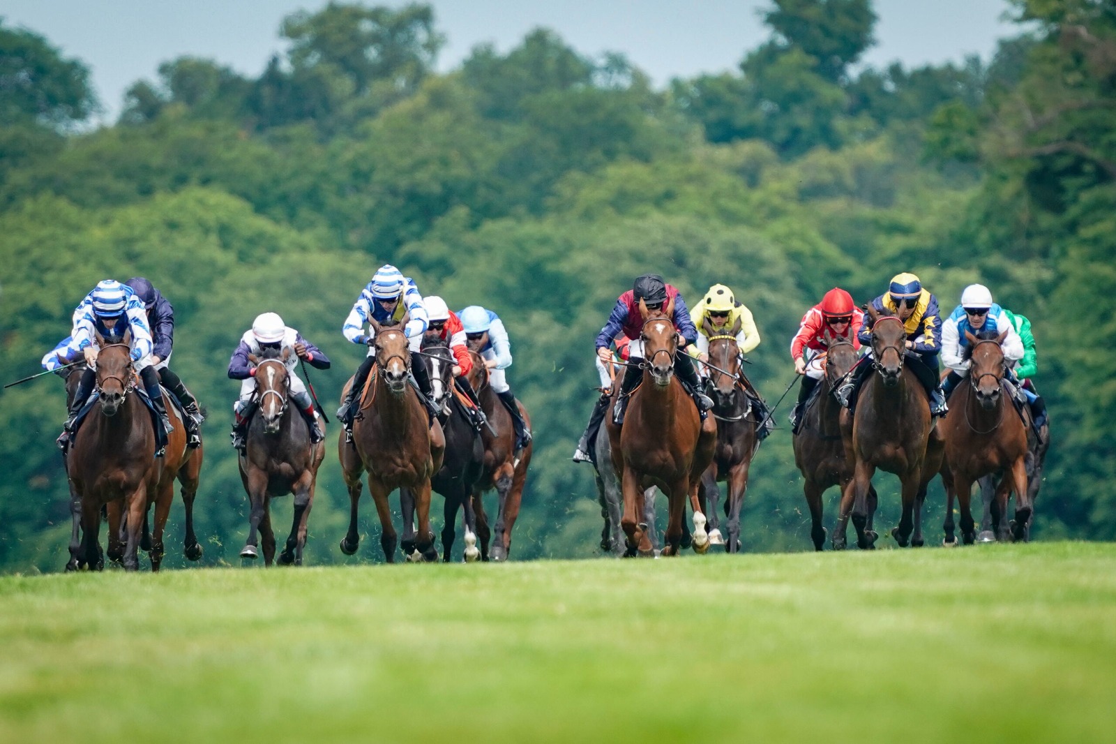 Horses and jockeys prepare for the Deauville Barrière Meeting 2025 at Deauville-La Touques Racecourse.