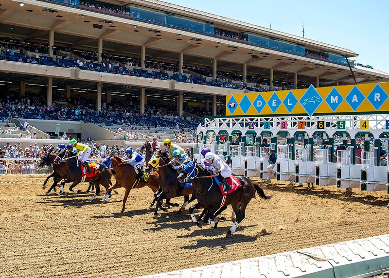 Del Mar racecourse during the 86th summer meet with cheering crowd and winning horses