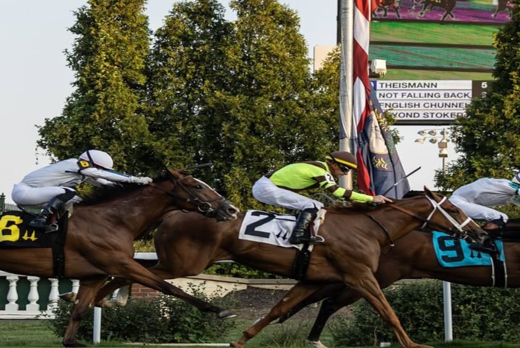 Horses racing under the Twin Spires at Churchill Downs during the September Meet