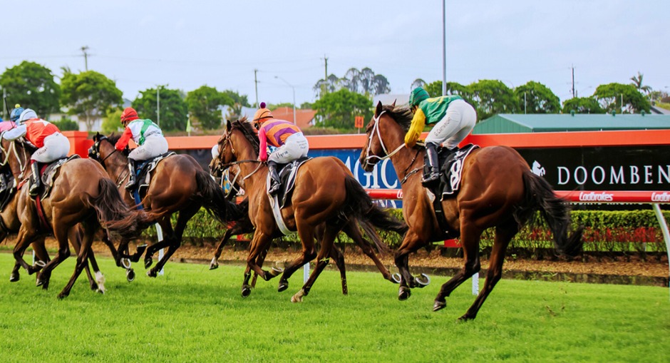 Horses racing at Doomben Racecourse during Spring Raceday, October 4