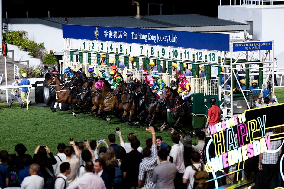 Happy Valley Racecourse during Happy Wednesday with horses on C+3 course and Oktoberfest festival setup