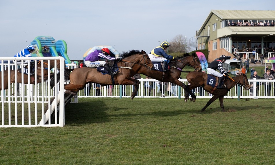 Horses racing at Hereford Racecourse during the Autumn Racing meeting