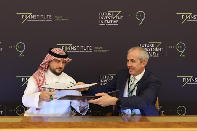 Dr. Rayan Karkadan and Fraser Houlder signing MoU for AlUla horseracing and equine welfare at Future Investment Initiative, Riyadh