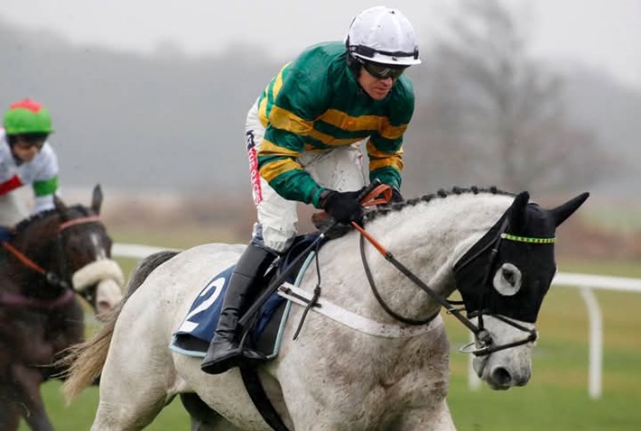 Horses racing under the floodlights at Wolverhampton Racecourse during the 2025 Twilight Races