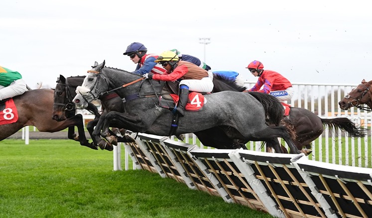 Bangor-on-Dee Racecourse hosts the November National Hunt meeting featuring eight thrilling jump races under autumn skies