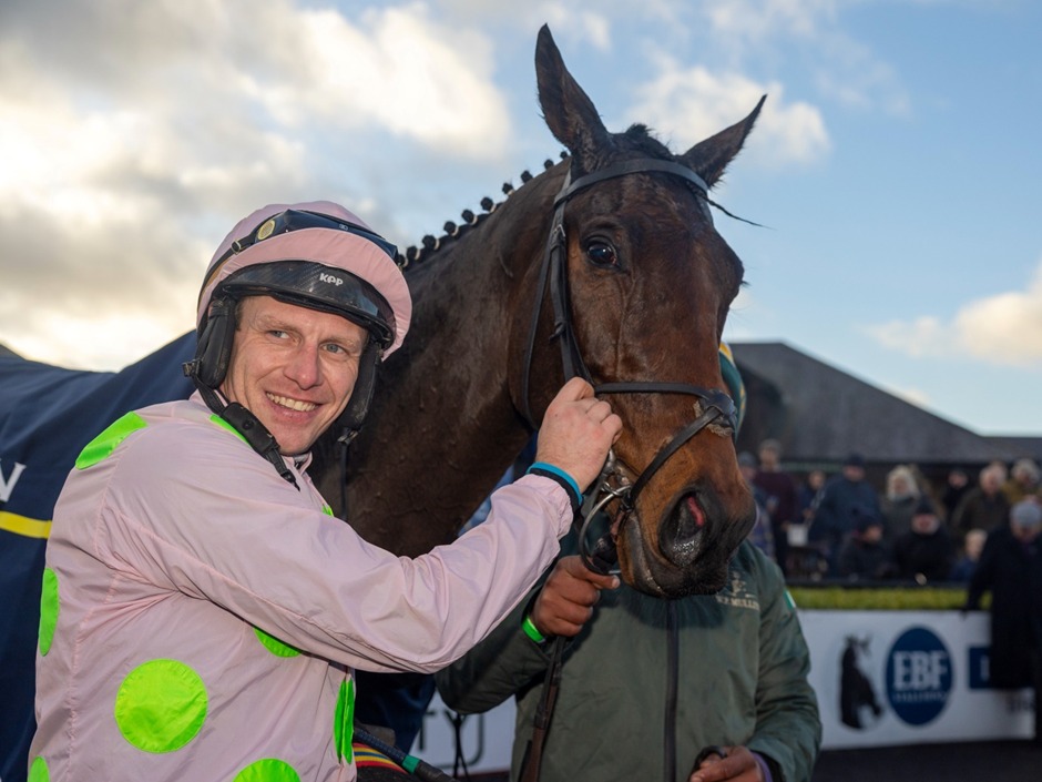Dundalk Polytrack race day action with thoroughbreds in full stride