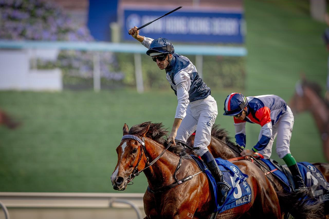Invincible Ibis crosses the finish line at Sha Tin to win the Hong Kong Derby