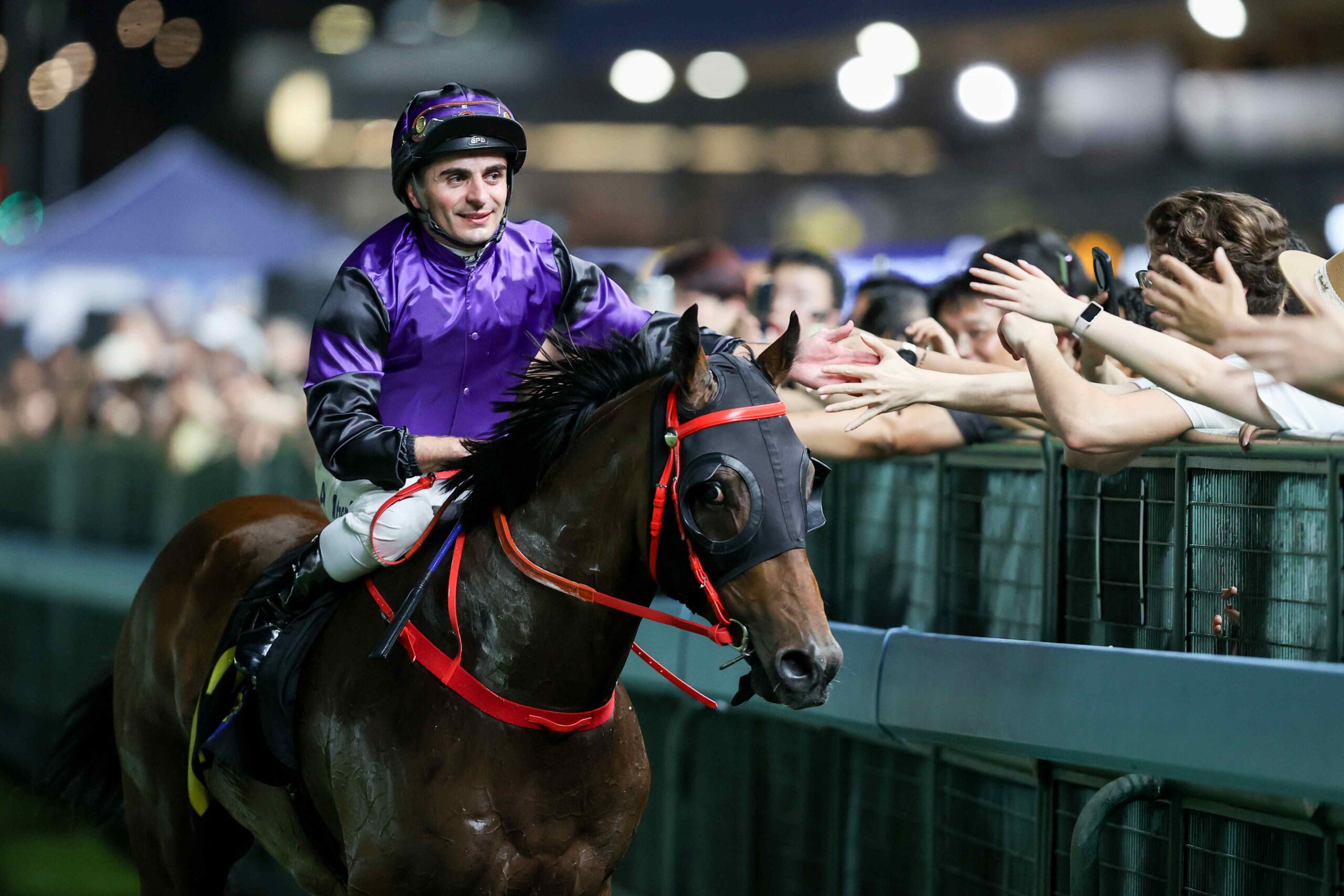 Andrea Atzeni riding at Sha Tin racecourse during Hong Kong meeting