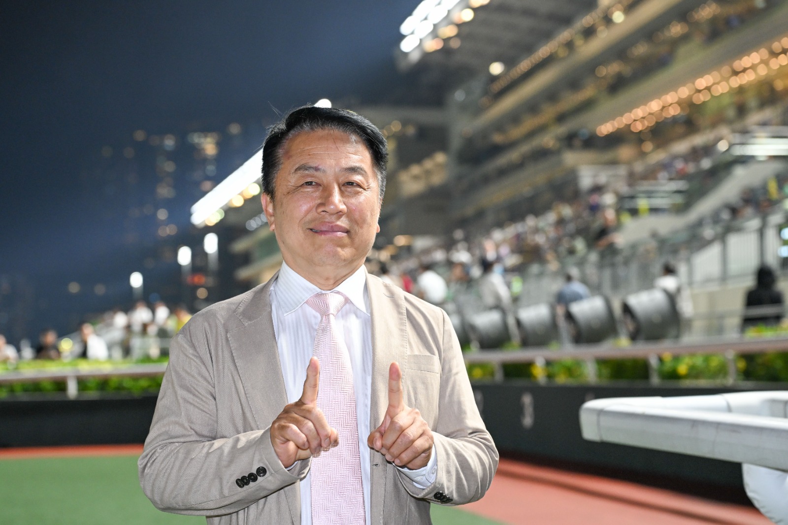 Ricky Yiu celebrates after Chill Buddy delivers his 1100th Hong Kong training victory at Sha Tin