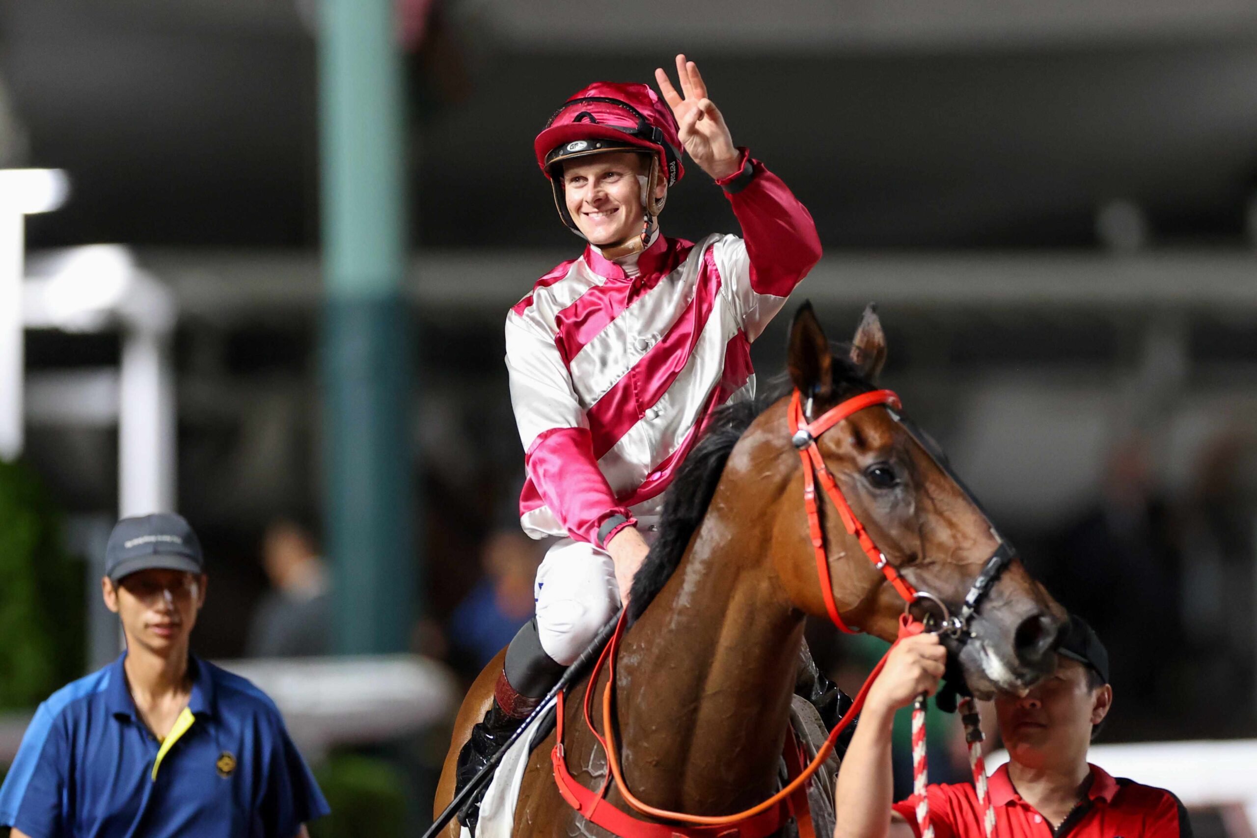Ethan Brown celebrates after riding a treble at Sha Tin racecourse in Hong Kong