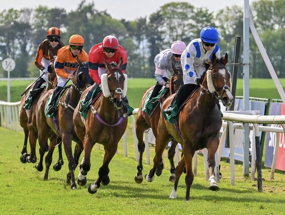 Winning horse crosses the finish line during Great Yarmouth racing on 15 July 2026