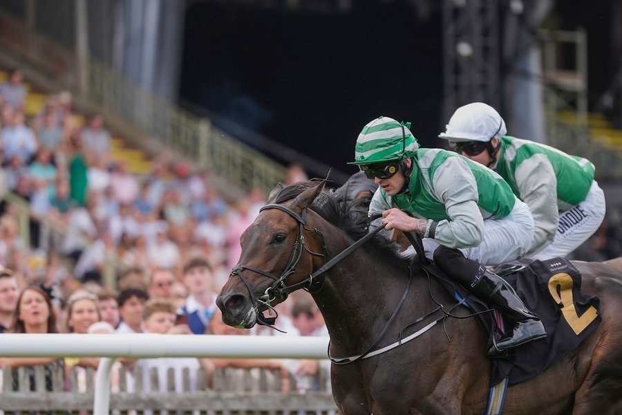 Peter O’Reilly celebrates after winning the Newmarket Town Plate aboard Alibey